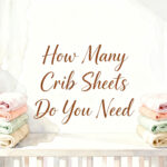 stacked folded crib sheets on a nursery shelf next to a white crib