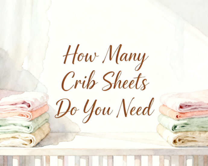 stacked folded crib sheets on a nursery shelf next to a white crib