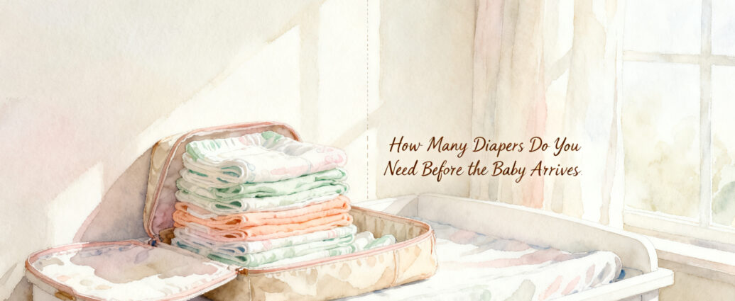 stack of newborn diapers next to size 1 diapers on a white changing table